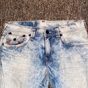 Bleached light wash and maroon colored jeans